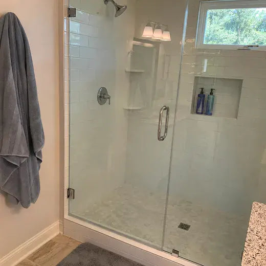 Clear glass shower door after mineral haze cleanup