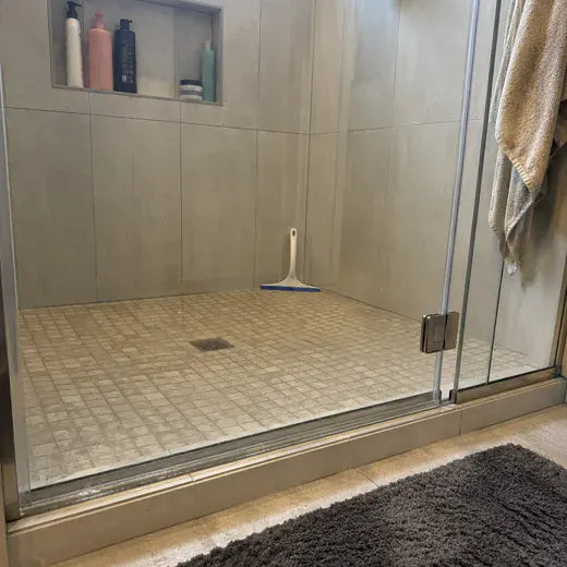 Shower glass with visible hard-water residue